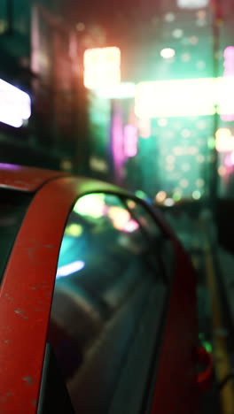 a red car parked on a street at night, with neon lights reflecting in the window.