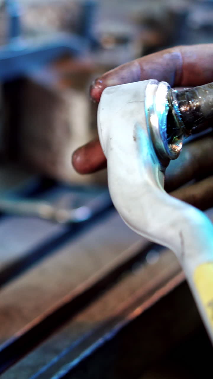 Worker at industry factory. Factory worker in the process of working. Vertical video
