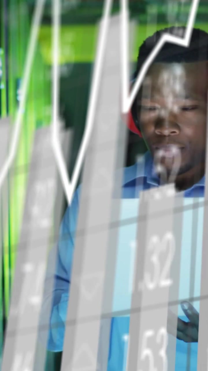 Vertical video: Tech adjusting tablet as overlays appearing on glass, monitoring rack data