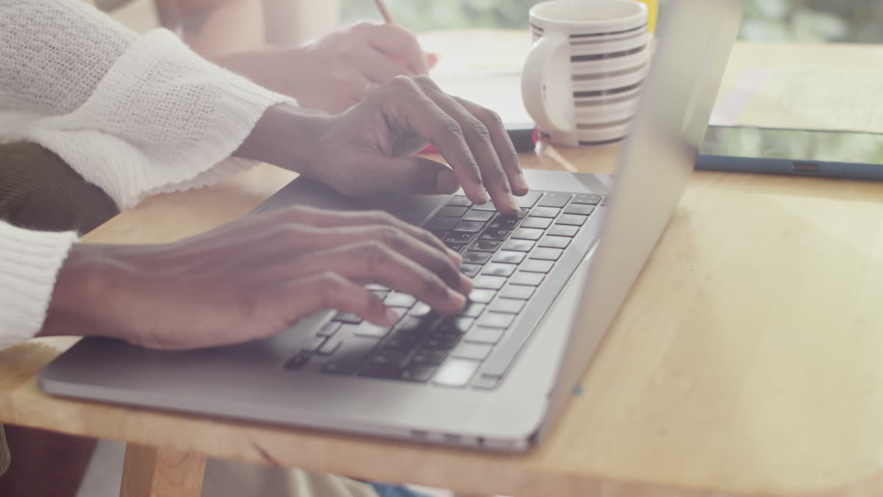 Hands of Students Doing Project on Laptop