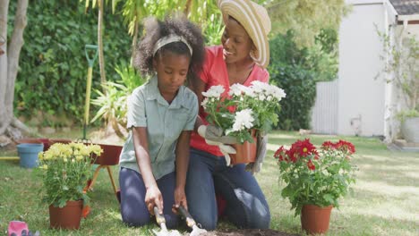 mother and daughter gardening during a sunny day