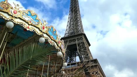 the eiffel tower behind the carrousel in paris