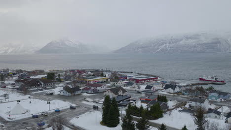 aerial view over small town fishing town of olderdalen, village in kåfjord in norway