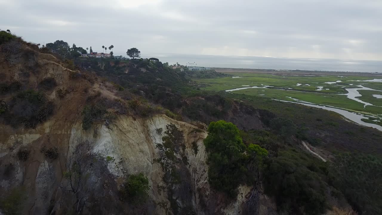 Drone shot flying over the mushroom caves located in San Diego.