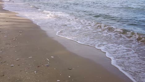 waves in the ocean and sand on the beach, blue sky sunny day in thailand