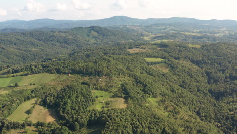 Drone-footage-of-amazing-Green-Forest-in-Middle-of-Bosnia-and-Herzegovina,-mountain-Majevica-with-stunning-spring-Season-and-big-mountains