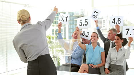 business people holding grade during meeting