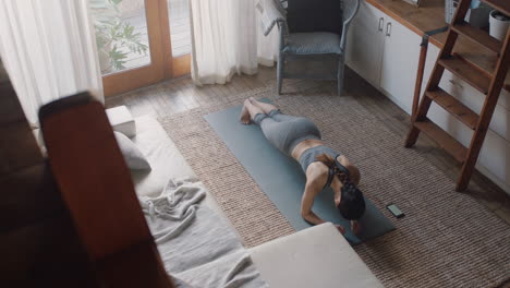 top-view-healthy-asian-woman-exercising-at-home-practicing-in-living-room-enjoying-morning-fitness-workout