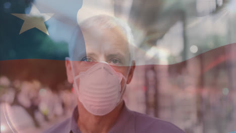 Animation-of-waving-chile-flag-over-portrait-of-caucasian-man-wearing-face-mask-on-the-street