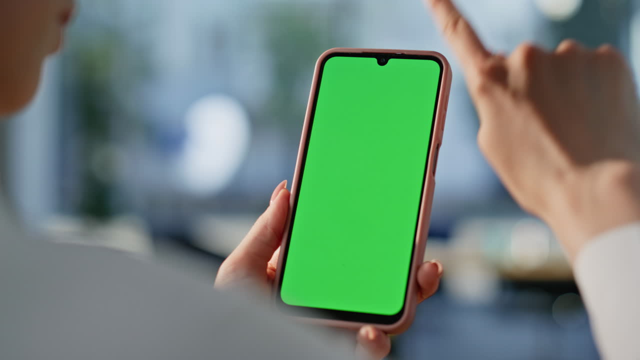 Hands scrolling chromakey mobile phone choosing online purchases at home closeup