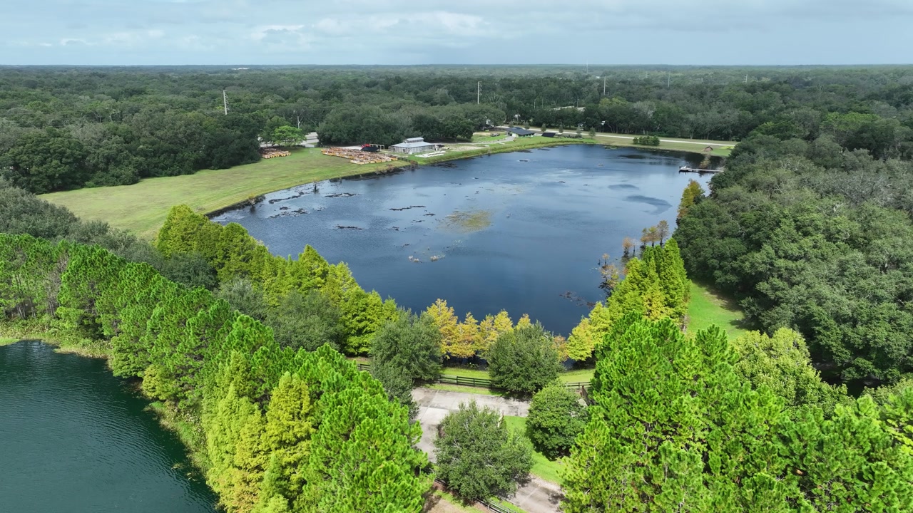 A high-altitude view over the lake and countryside of Club Lake Venue.