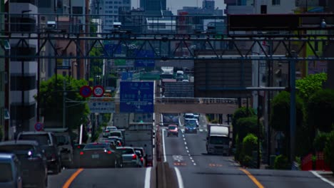 a timelapse of the traffic jam at the urban street in tokyo long shot