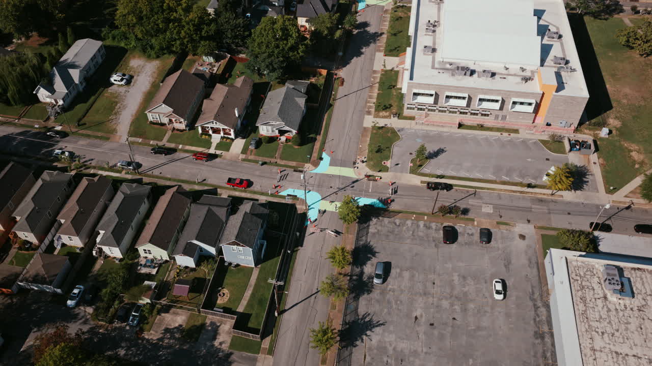 Drone shot capturing a neighborhood view of Chattanooga where artists and residents collaborate to paint a large intersection mural