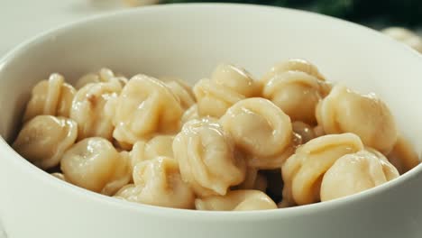 deliciously cooked pelmeni in a white bowl