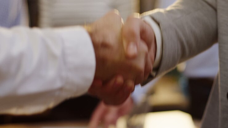 Close-up view of businessmen handshake in the office
