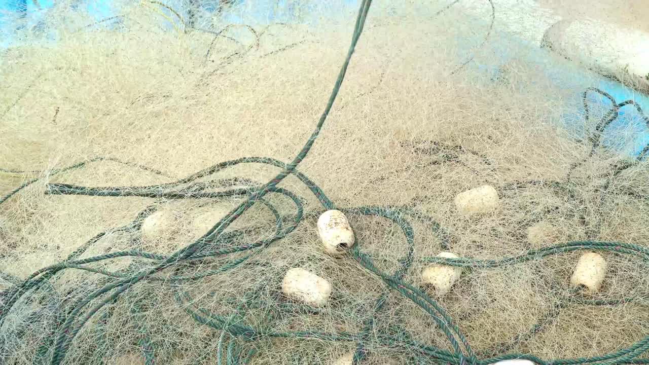 Fishing nets stacked on a boat. Tangled nets on a boat.