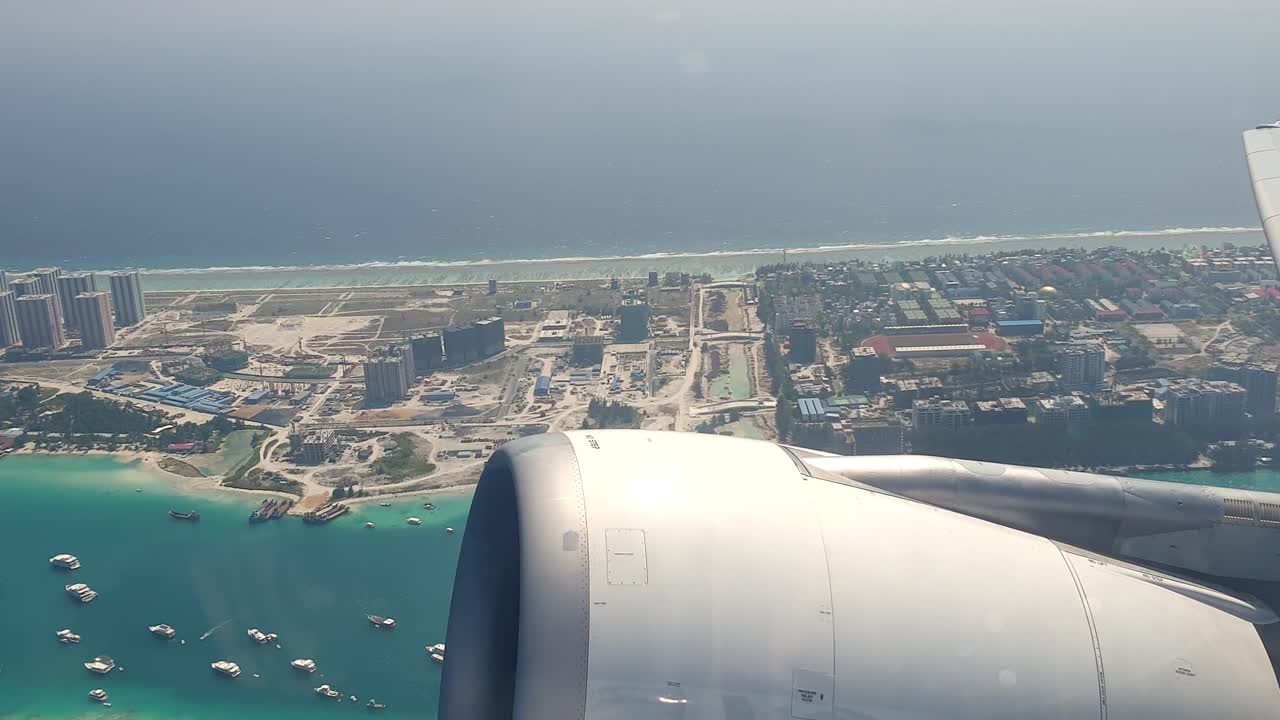Overflying Maldives top aerial view from airplane