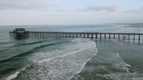 aerial drone shot of newport beach pier - pull back - 4k uhd