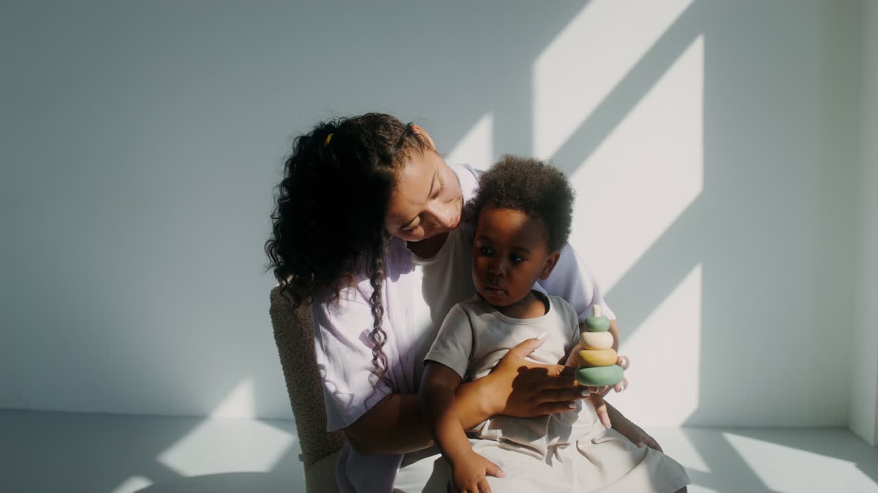 Mother and Child Playing with Stacking Rings