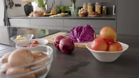 close up of food in bowls on countertop in kitchen, slow motion