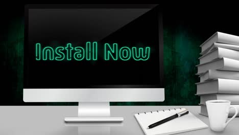 animation of words install now flickering on screen of desktop computer standing with books on desk