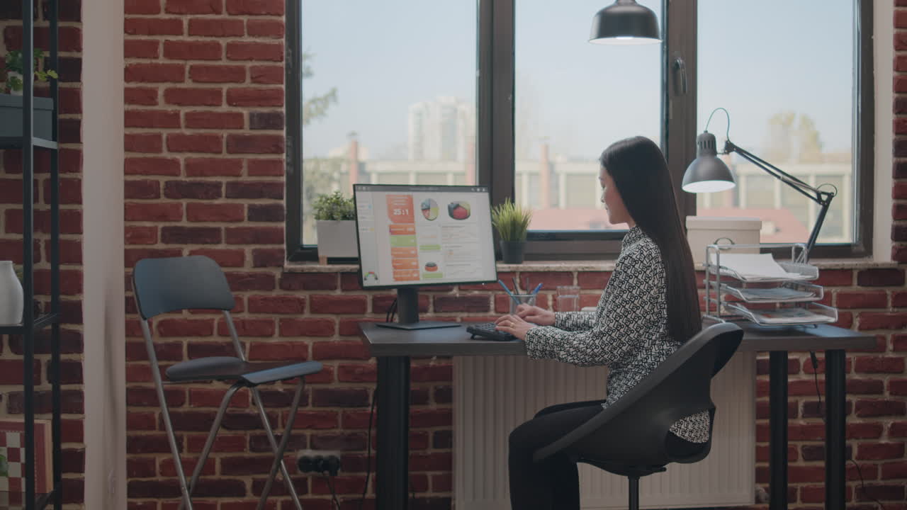 Employee using computer to work on startup business plan | Premium ...