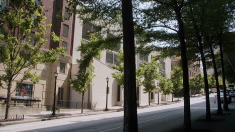 city street with parking garage and trees