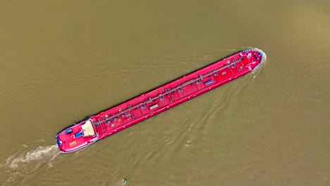 Industrial-barge-tanker-ship-cruising-up-river-Rhine-transporting-Cargo