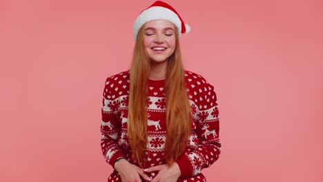 Lovely-positive-adult-girl-in-Christmas-sweater-laughing-out-loud-after-hearing-anecdote,-funny-joke