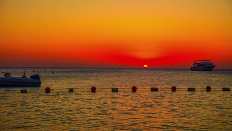 sunrise time lapse as the sun rises above the horizon of the red sea in egypt