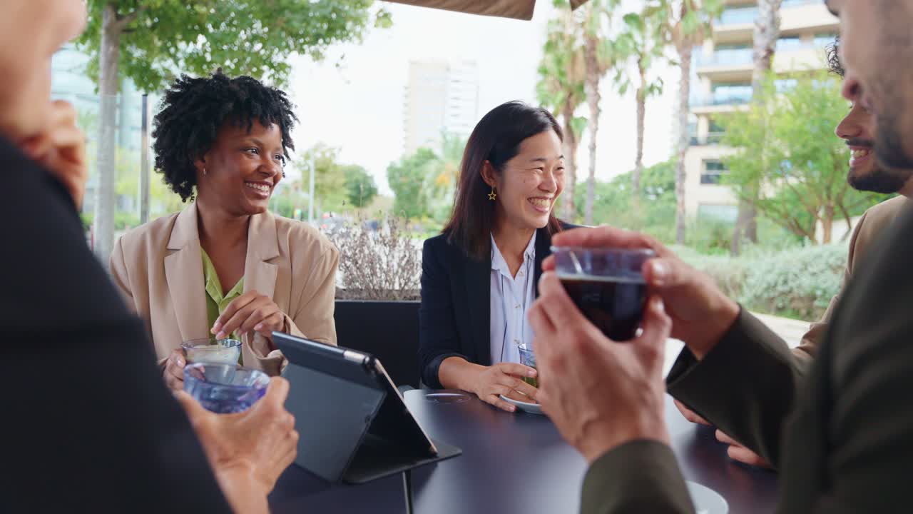 Business team enjoying a coffee break outdoors