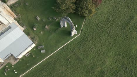 top view of ruined arch within the wymondham abbey yard in norfolk, england