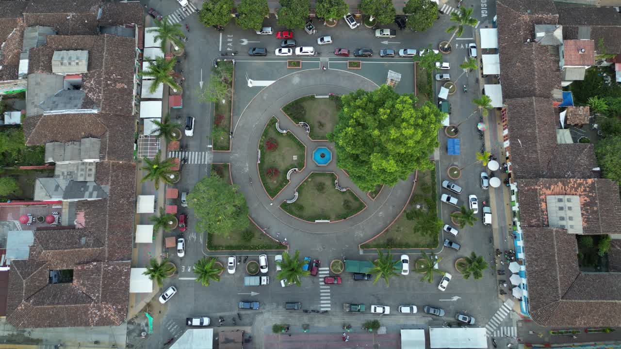 Traffic around the central park of the andean town of Marsella in the department of Risaralda in the Colombian Coffee Triangle
