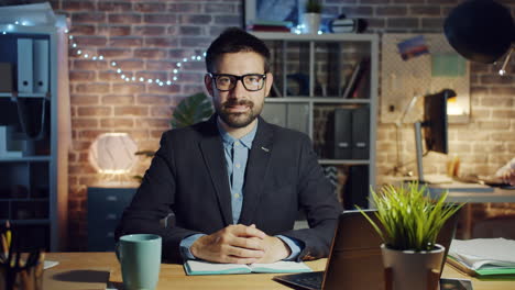 man working late in his home office