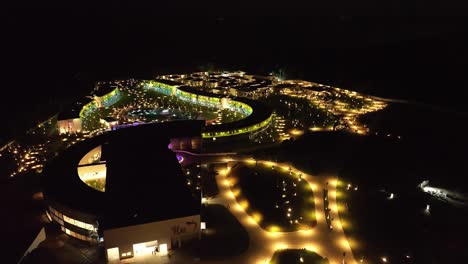 aerial view of temptation miches resort at nighttime in dominican republic - drone shot