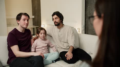 gay couple discussing their relationships with daughter to psychologist