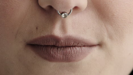 close-up-woman-lips-smiling-happy-wearing-nose-ring-makeup-cosmetics-feminine-beauty
