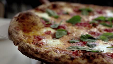 Margherita-sour-dough-pizza-cooked-from-Sicily's-Pizzeria-in-Detroit,-Michigan-with-video-panning-left-to-right