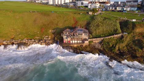 fierce atlantic ocean waves along cornwall's sea spray fistral cafe along the cliffs of newquay, uk