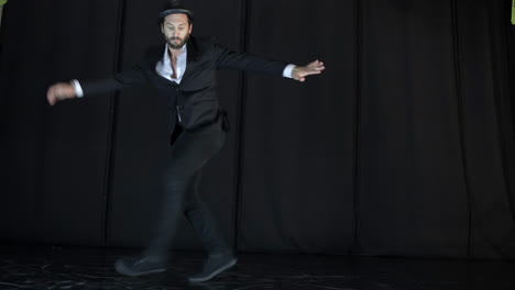 man performing contemporary dance on stage