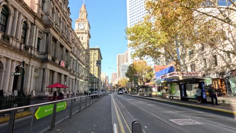 tram moving along a busy melbourne street