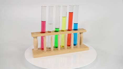 test tubes with colored liquids rotating on a platform