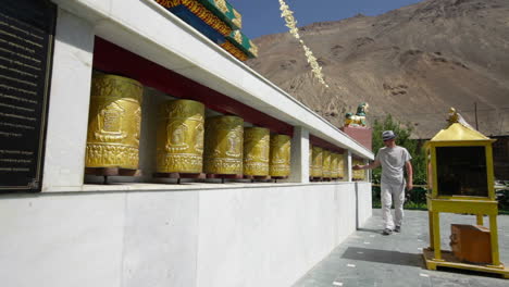 Tibetan-Buddhist-prayer-wheels-in-Buddhism-temple.