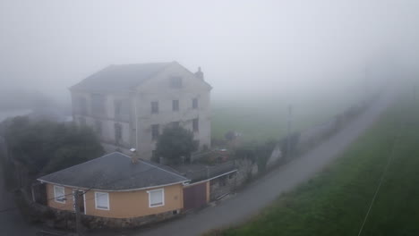 foggy abandoned house in the countryside