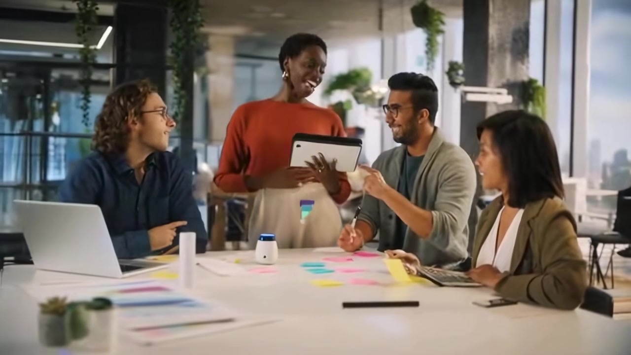 Diverse Team of Colleagues Brainstorming with Sticky Notes in a Modern Office