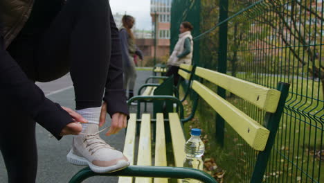 woman tying her shoelaces