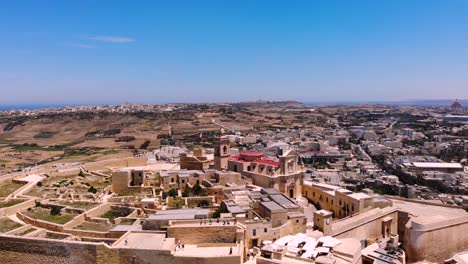 cittadella, fortress from medieval era drone aerial shot fly backward, gozo island reveal, malta