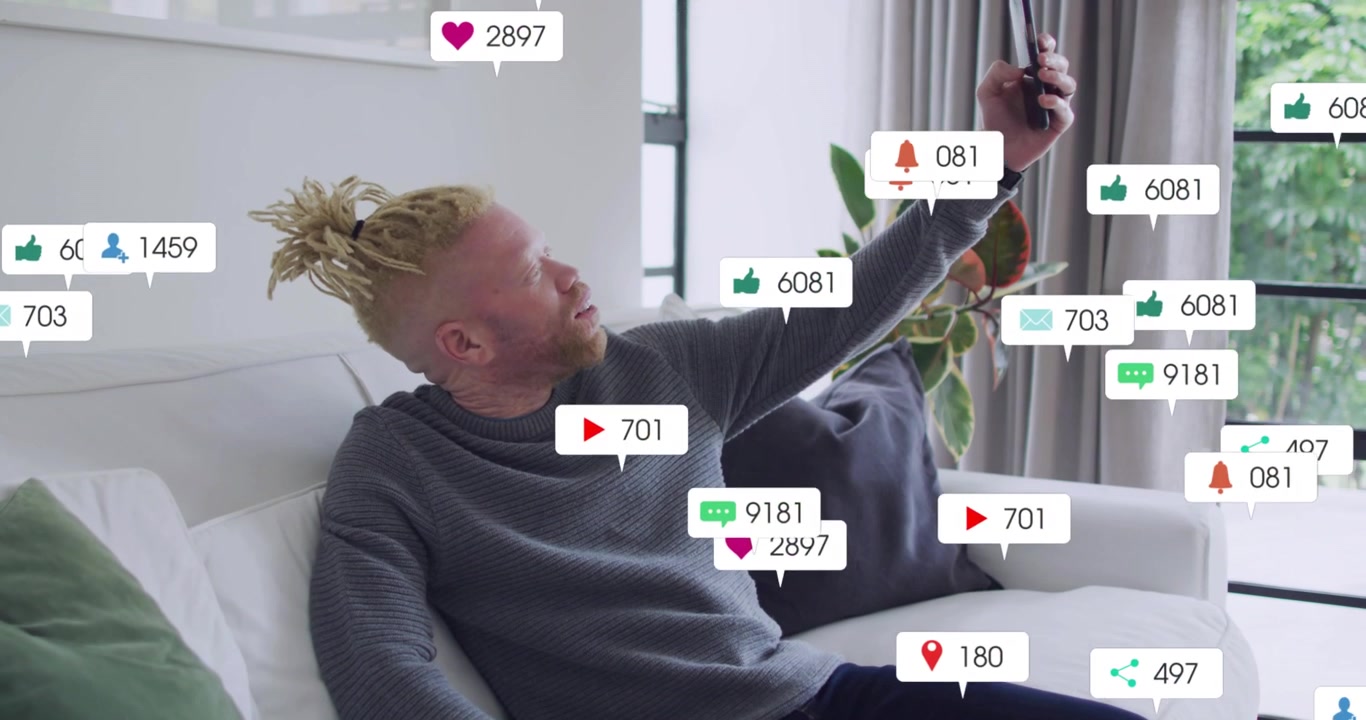 Man raising phone toward window, causing social media badges multiplying while seeking better light