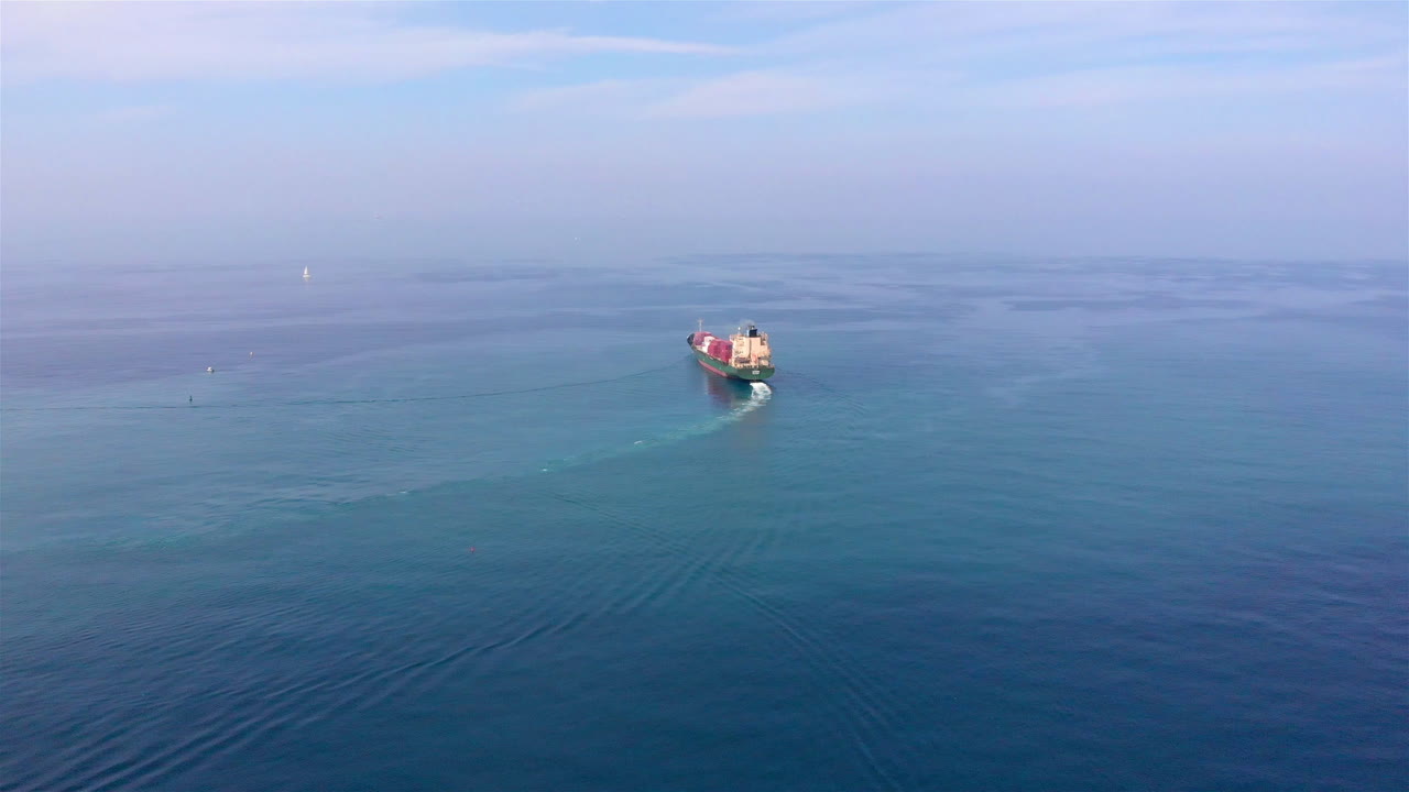 Aerial footage over Container Cargo Ship Sailinig in Mediterranean Sea