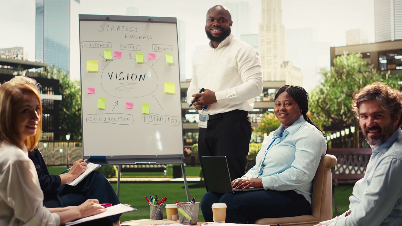 Portrait of diverse businesspeople discussing project timeline on whiteboard